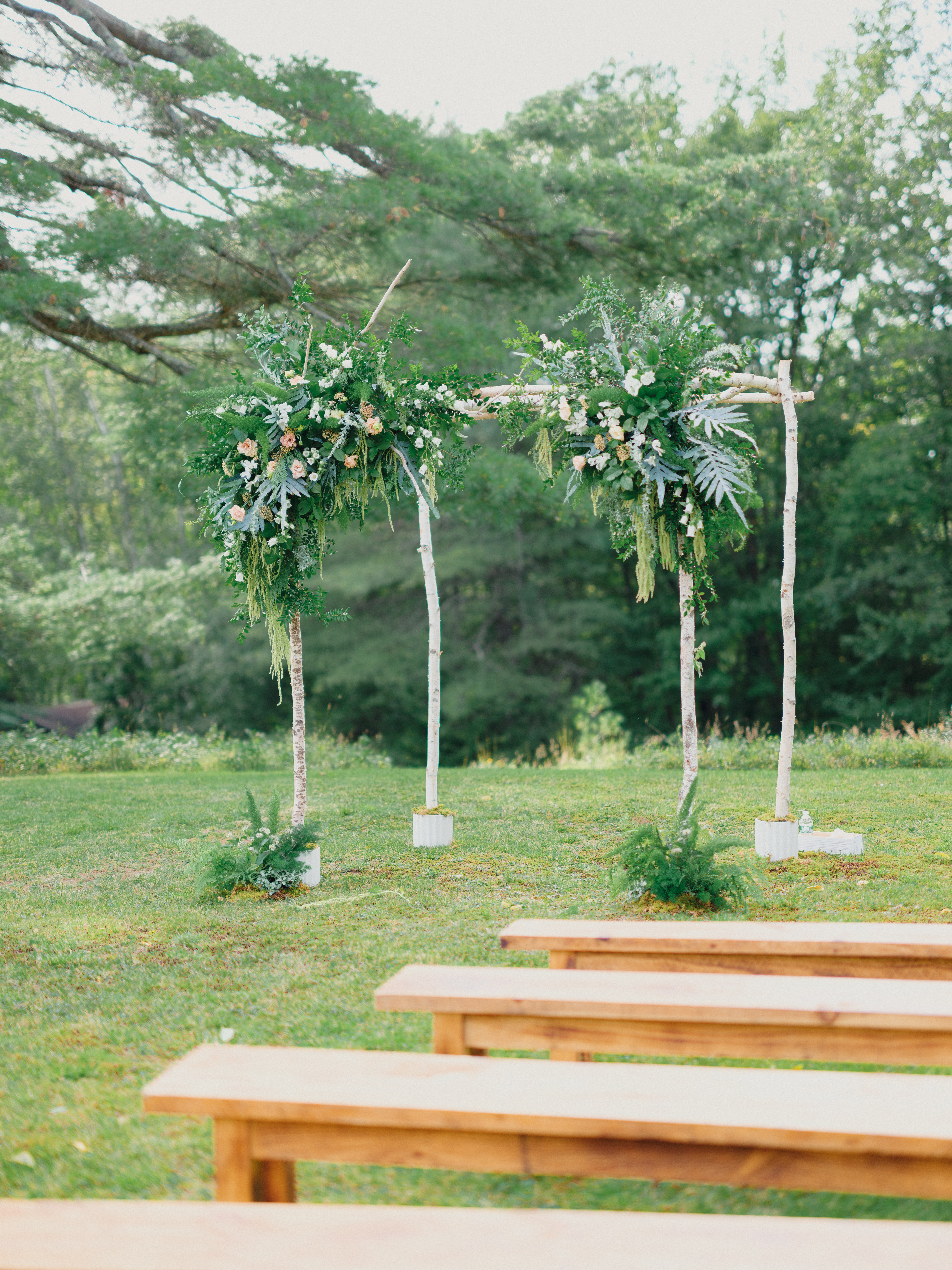 Woodland chuppah wedding flowers installation in the Adirondacks.