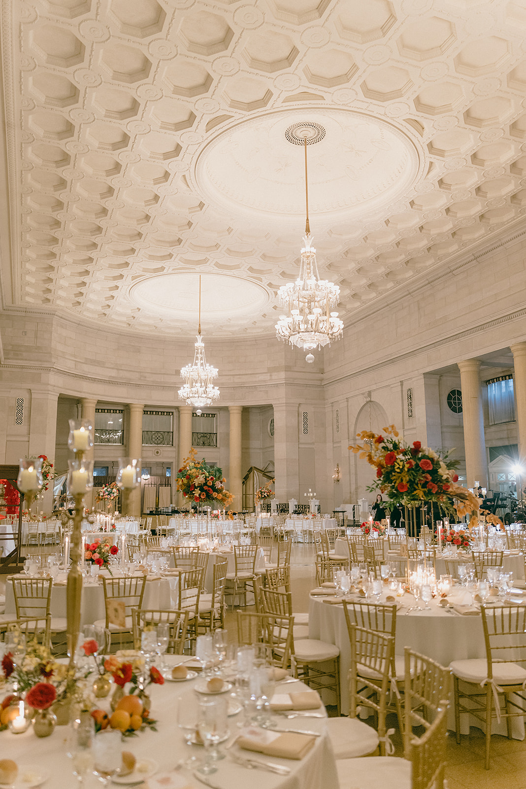 Fall wedding reception at Saratoga Hall of Springs showing ballroom with a variety of floral centerpieces