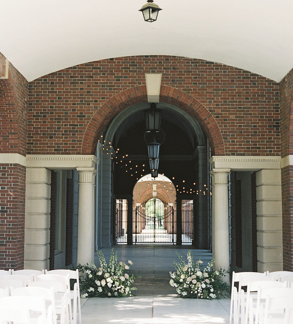 Wedding Ceremony setting at Hall of Springs with two large floral arrangements in blush and white.