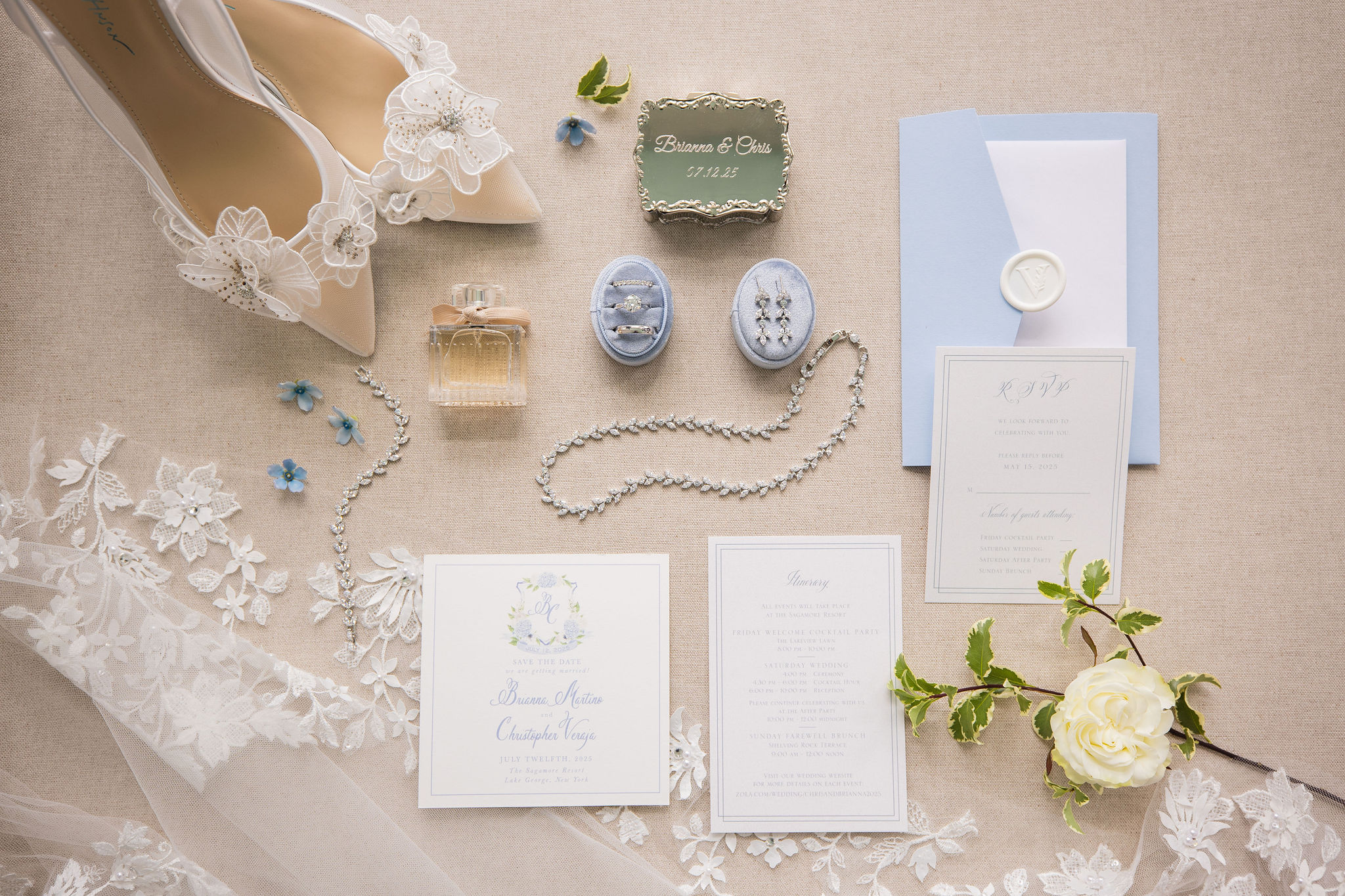 An assortment of wedding day items, including jewelry, shoes, invitations, and flowers, attractively displayed.